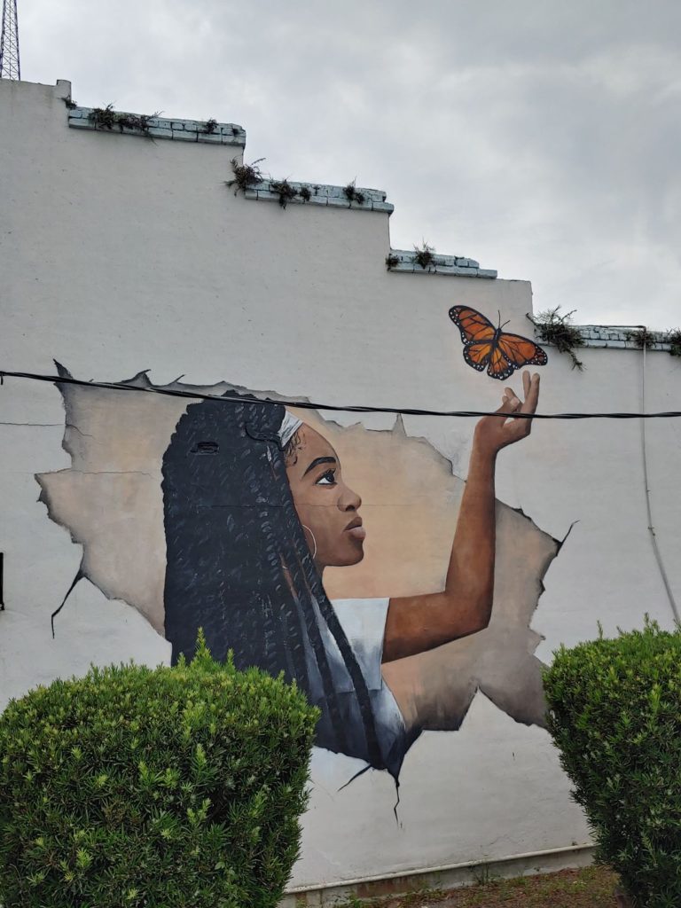 Girl releasing butterfly